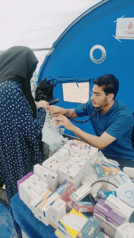 Medical volunteer treating a patient