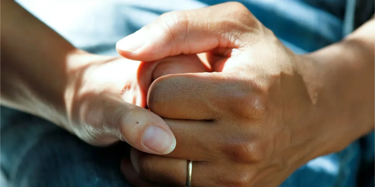 Hands held in support