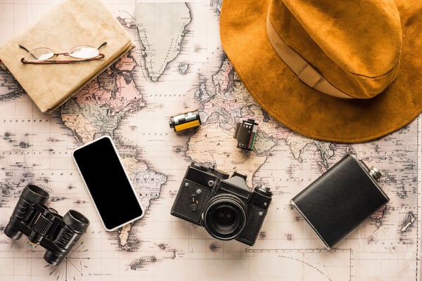 10 ways to raise money for a trip including crowdfunding, side hustles, and selling items